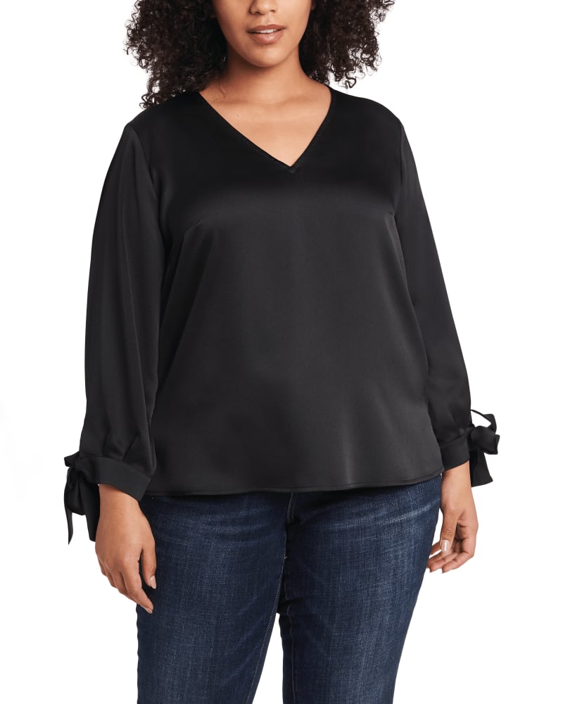 Front of a model wearing a size 1X Aubree Tie Sleeve Blouse in RICH BLACK by CeCe. | dia_product_style_image_id:263628